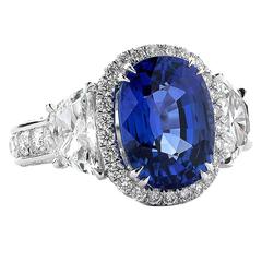 6.03 Carat Oval-Shaped Blue Sapphire and Half-Moon Diamond platinum Ring