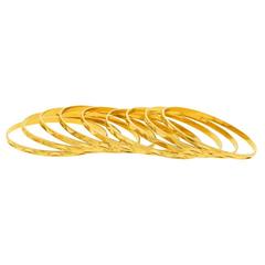 Nine Gold Bangle Bracelets