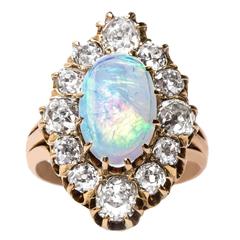 Bold Antique Cocktail Ring with Oval Opal and Old Mine Cut Diamonds