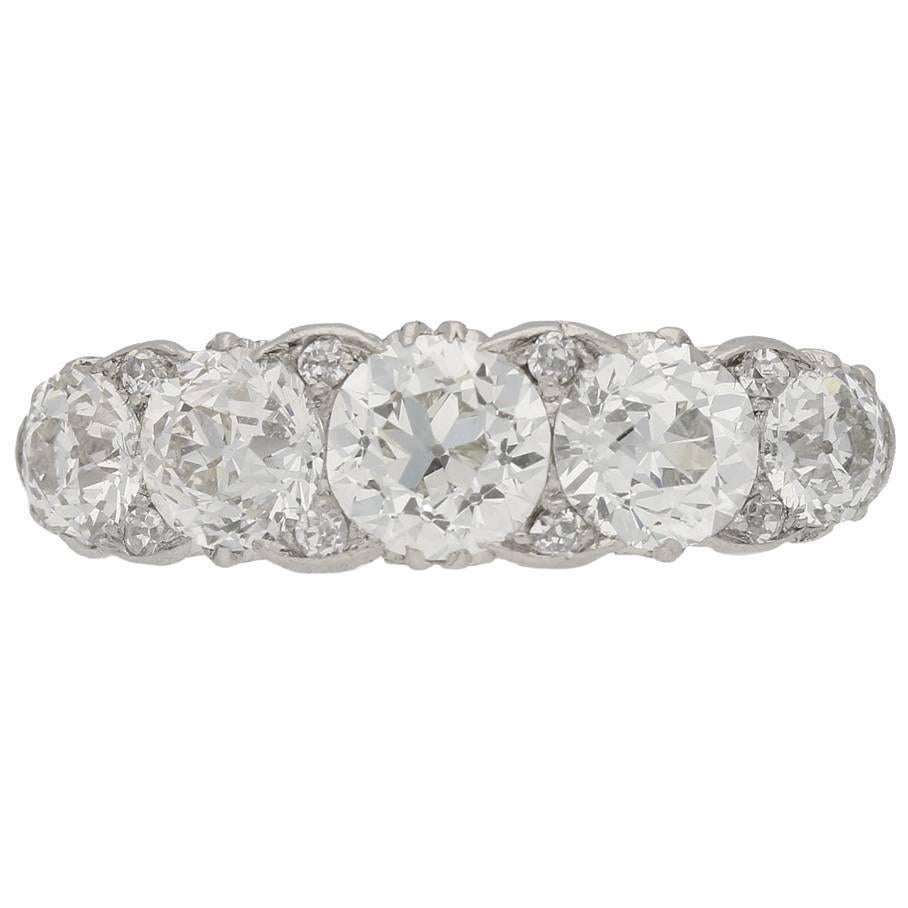 Antique five stone diamond carved half hoop ring, circa 1905. For Sale