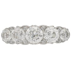 Antique five stone diamond carved half hoop ring, circa 1905.