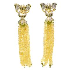 1980s Yellow Sapphire and Diamond Bow Dangle Earrings. 