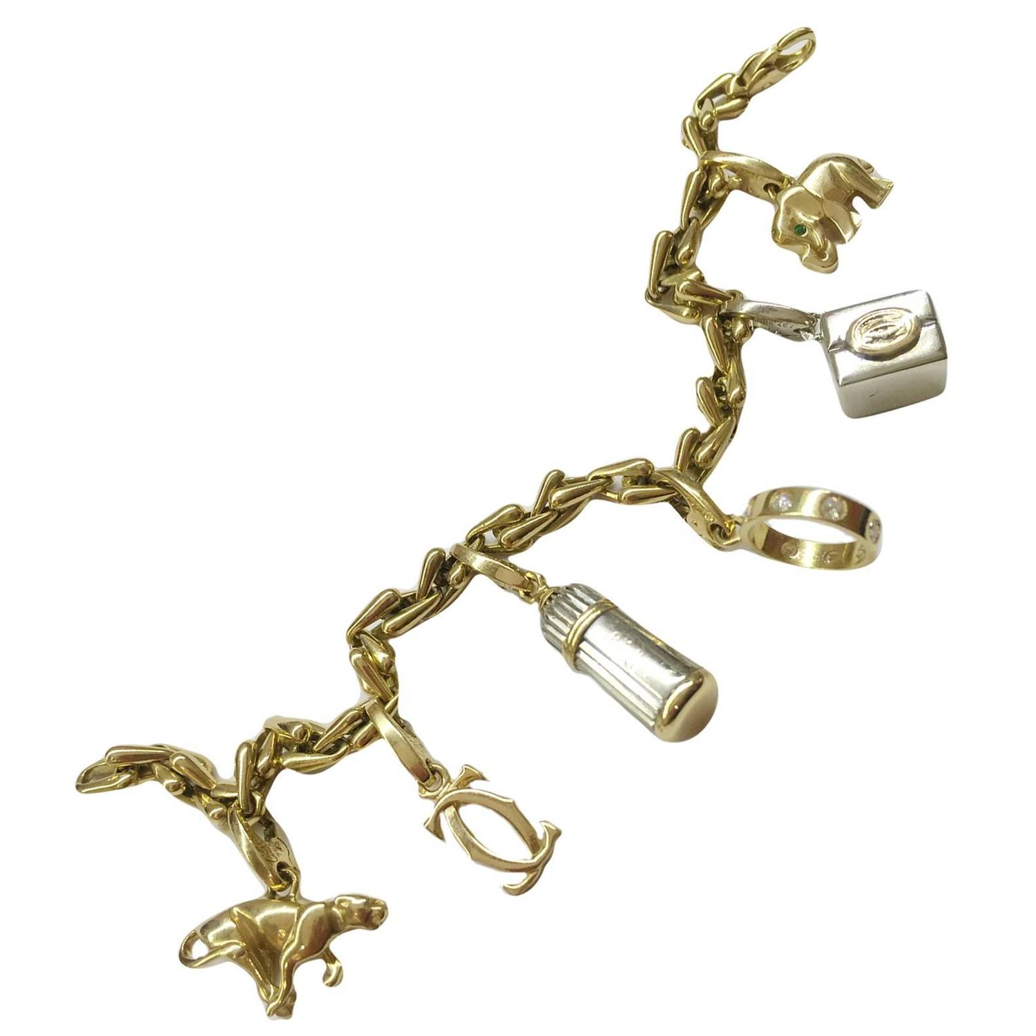 Cartier Two color gold charm bracelet at 1stdibs