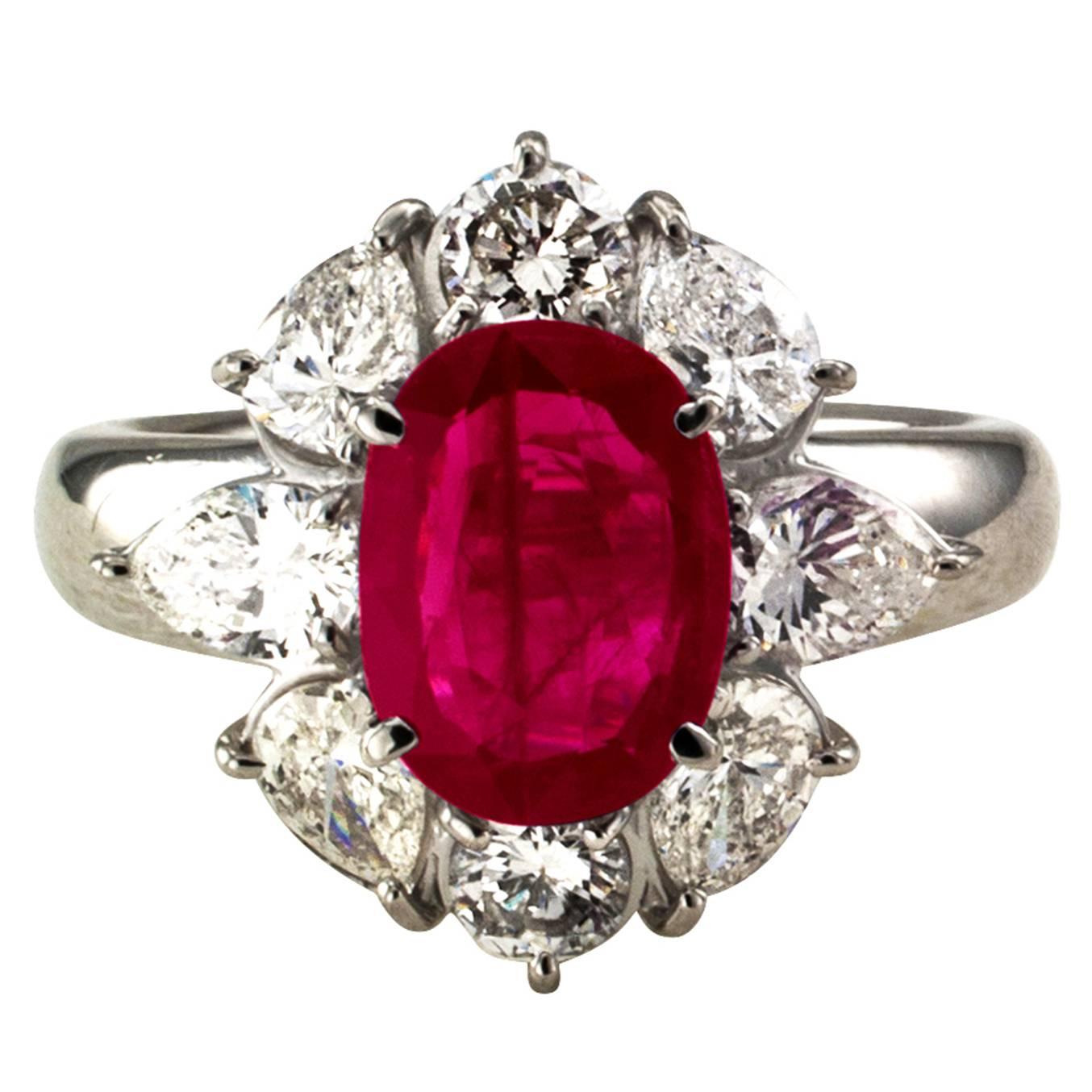 2.23 Carats Burma Ruby and Diamond Platinum Ring

Shimmering and delightful as only a beautiful ruby can be, enthroned in an equally outstanding platinum mount generously accessorized with pear-shaped and round brilliant-cut diamonds totaling