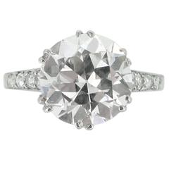 Edwardian solitaire diamond ring with diamond set shoulders, circa 1905. 1