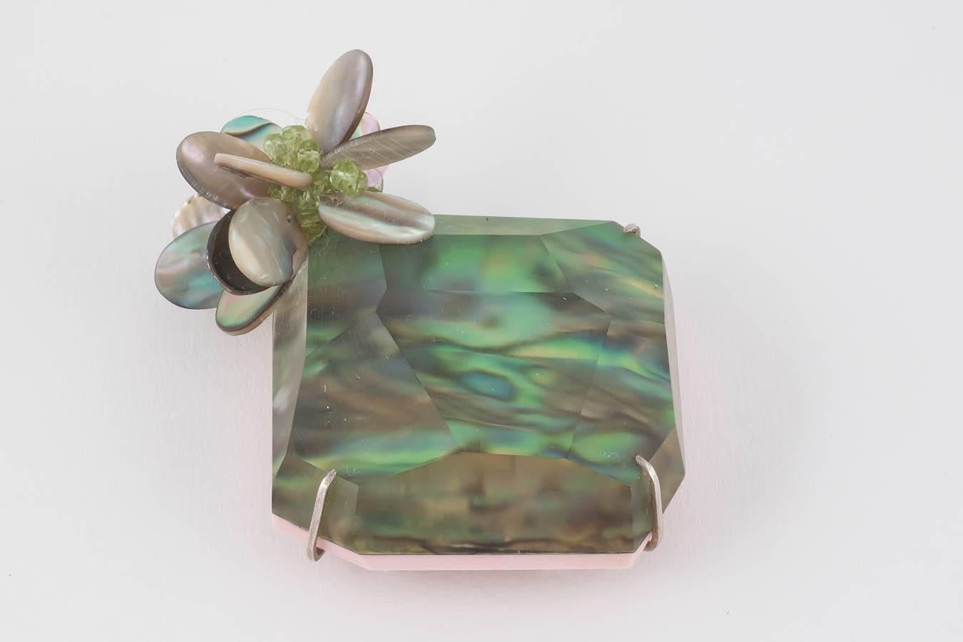 Exquisite Donna Brennan Paura Shell & Lucite Brooch with Peridot & Paura Shell Clusters, set in a Sterling Silver frame. Published in The Goldsmiths' Fair catalogue 2015 and Craft Arts International 2016.
Main Image Credit: Richard Valencia for The