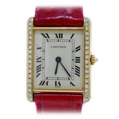 Cartier Lady
s yellow gold diamond set bezel Tank wristwatch
