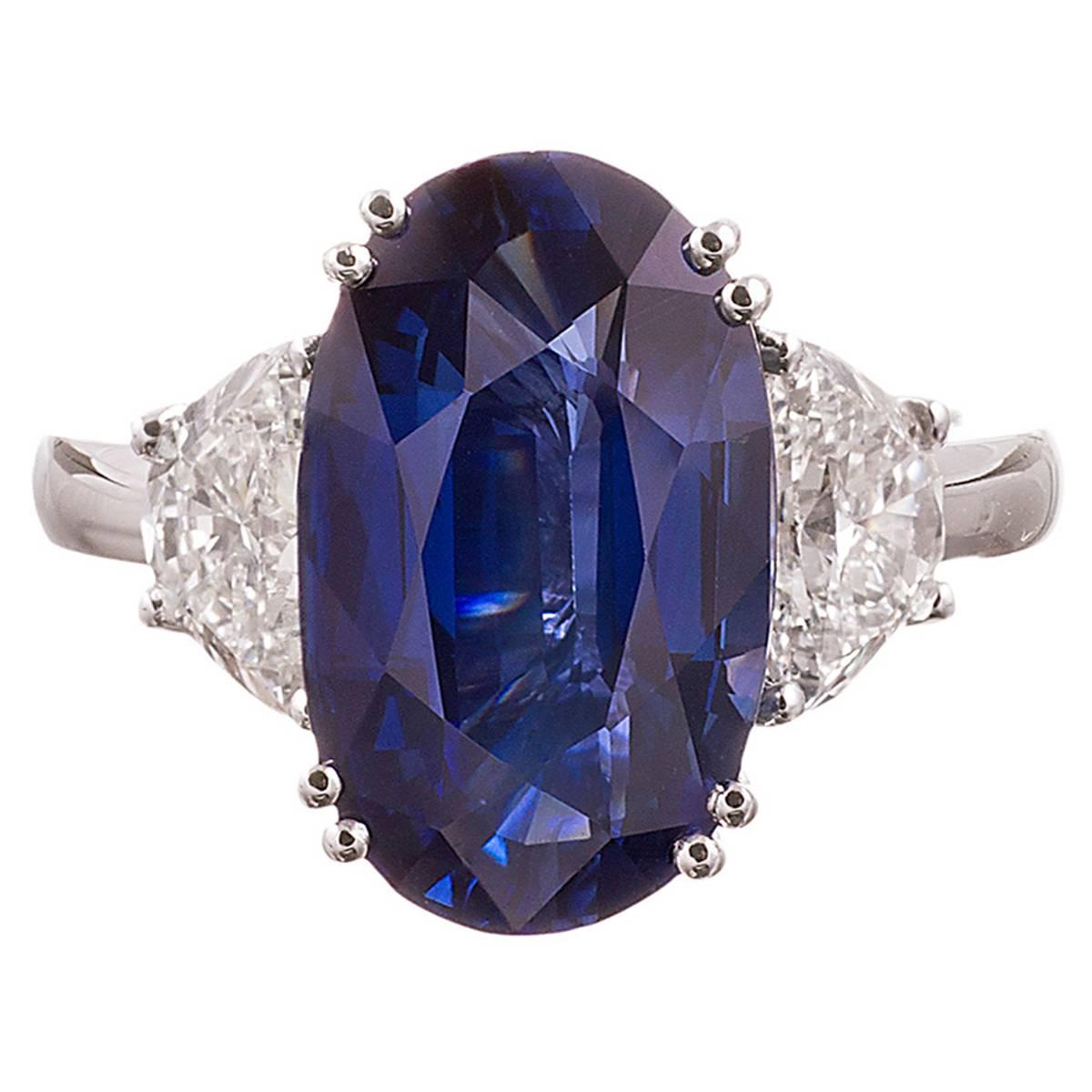 7.66 Carat Oval Sapphire and Half Moon Diamond Platinum Ring