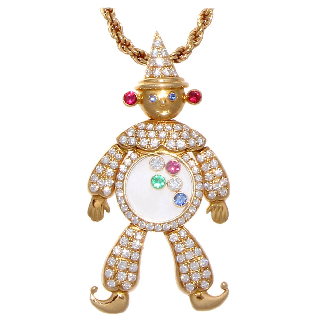 A fun and exciting color-filled portrayal of comic relief by Chopard. This clown has been dressed in an 18k gold costume polka dotted with numerous near colorless diamonds and a transparent belly filled with free moving polka dots of diamonds,