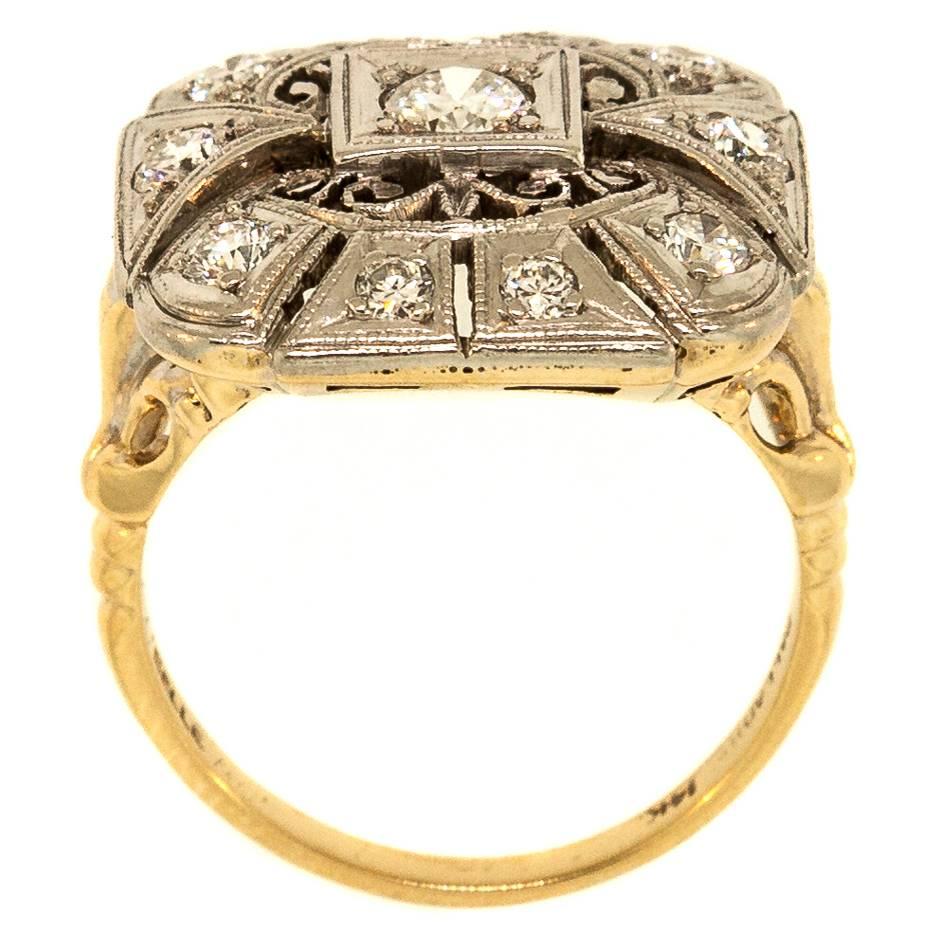 Beautifully designed 1940's Palladium topped 14KT yellow gold filigree ring, accented with a carat of Transitional and Old European Cut Diamonds.  The square design ring is enhanced with delicate open work and time worn milgrain. 
Make it your