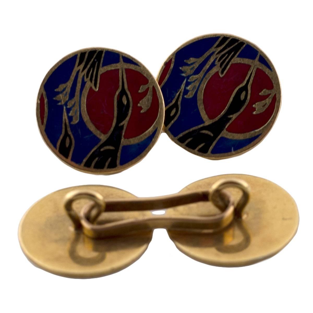 These French 18K Yellow Gold and Enamel cufflinks are decorated with Japanese-styled cranes in a beautiful and serene setting. Blacks, blues, and reds set the scene in enamel in the time period of the 1940's. Vintage and elegant these stunning