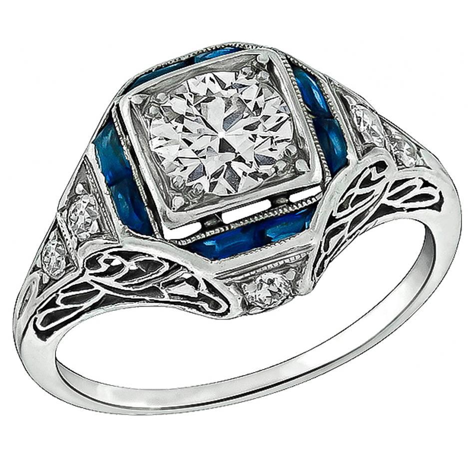 Enticing 0.70 Carat Diamond Sapphire Platinum Engagement Ring For Sale