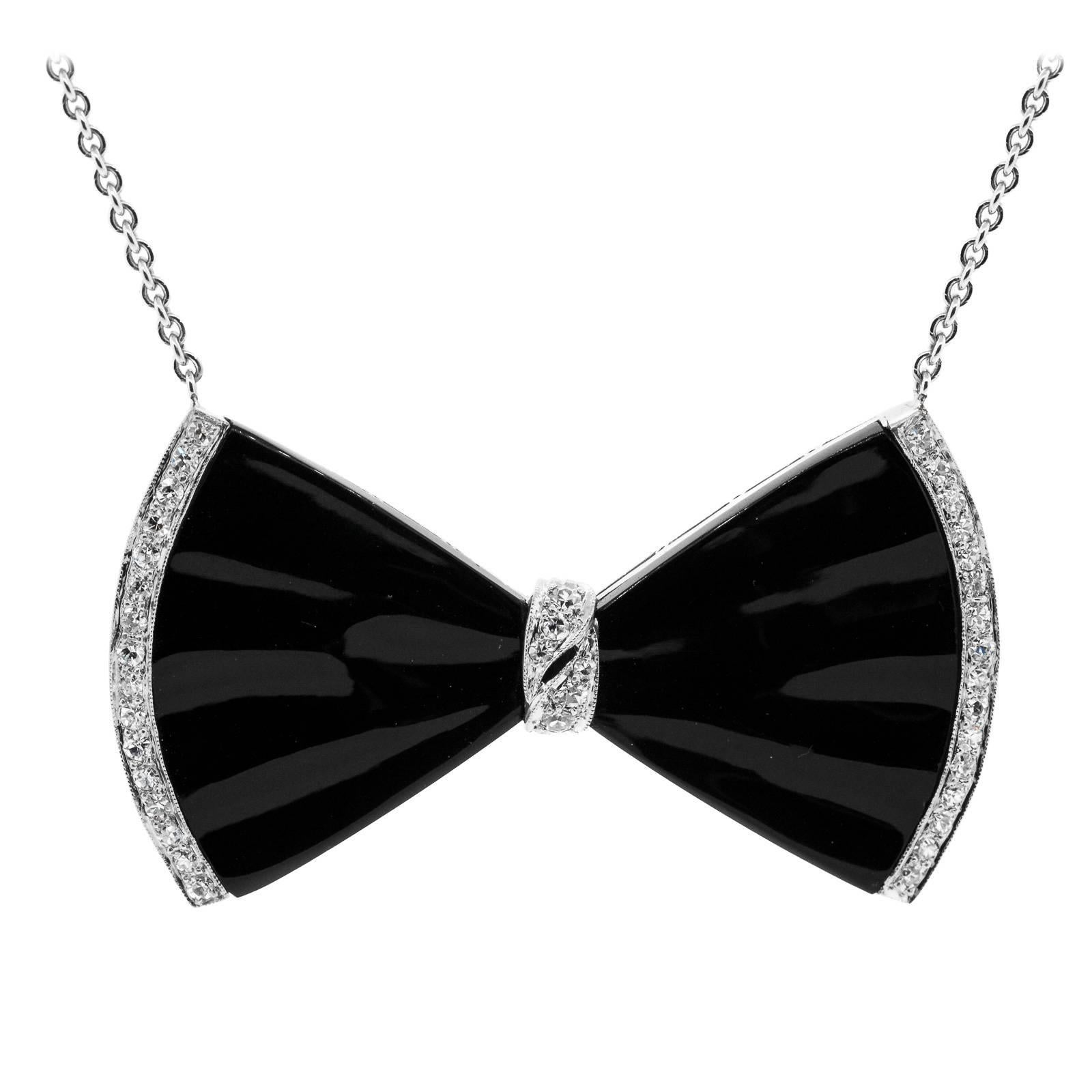 1930s Onyx Diamond Platinum Bow Pendant