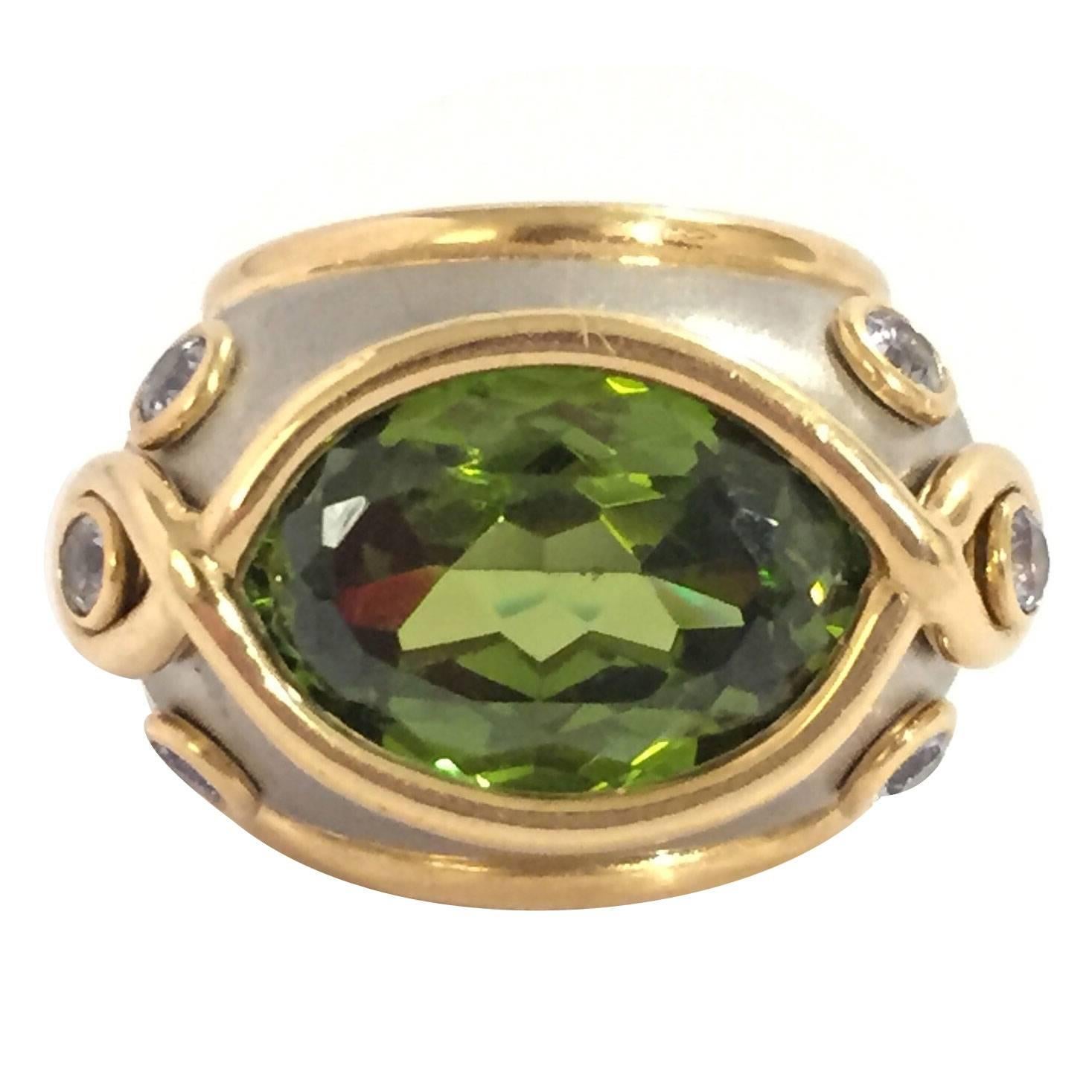 Andrew Clunn Anello con peridoto e acquamarina in oro e platino