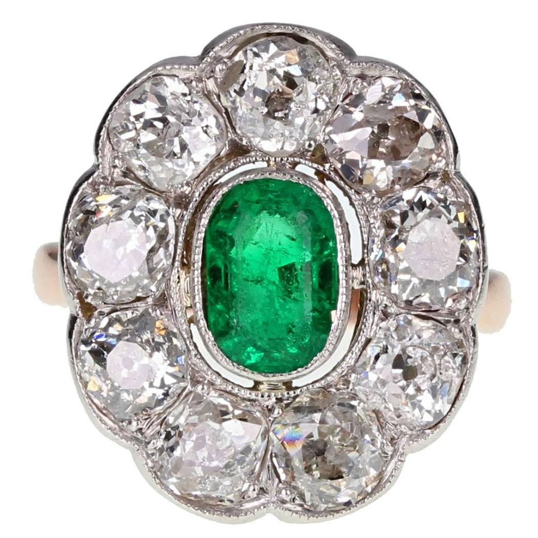 Antique Oval Emerald and Diamond Cluster Ring in Gold