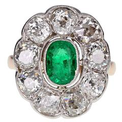 Antique Oval Emerald and Diamond Cluster Ring in Gold 9