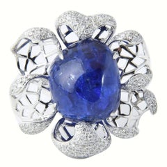 Anello moderno a fiore d'oro con tanzanite grande e diamante