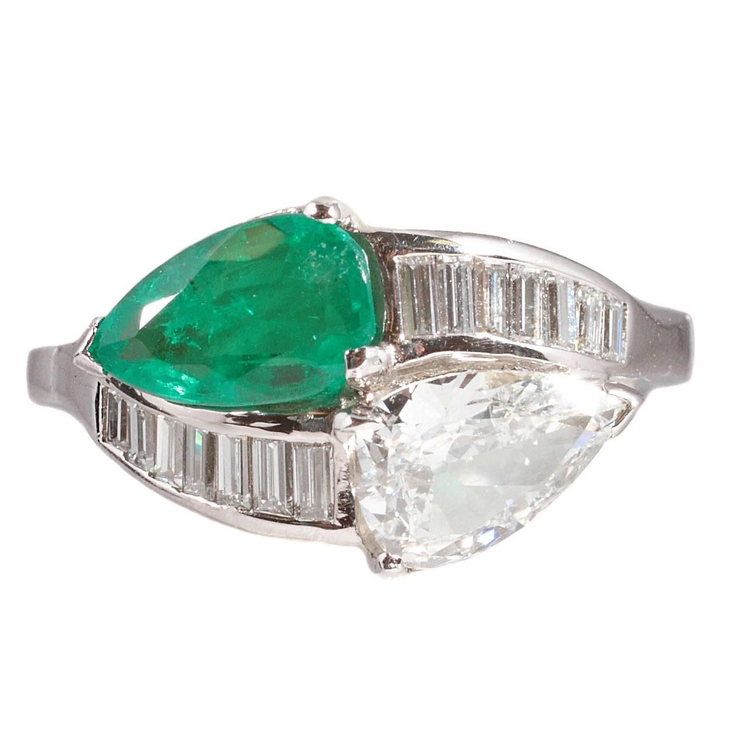 1950s 1.08 Carat Emerald 0.83 Carat Diamond Platinum Bypass Ring