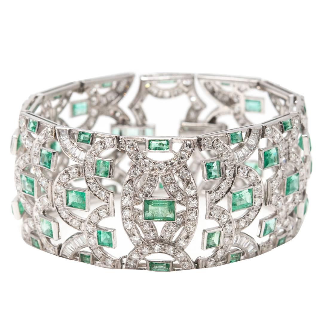 1930s Emerald Diamond Platinum Scroll Motif Bracelet For Sale