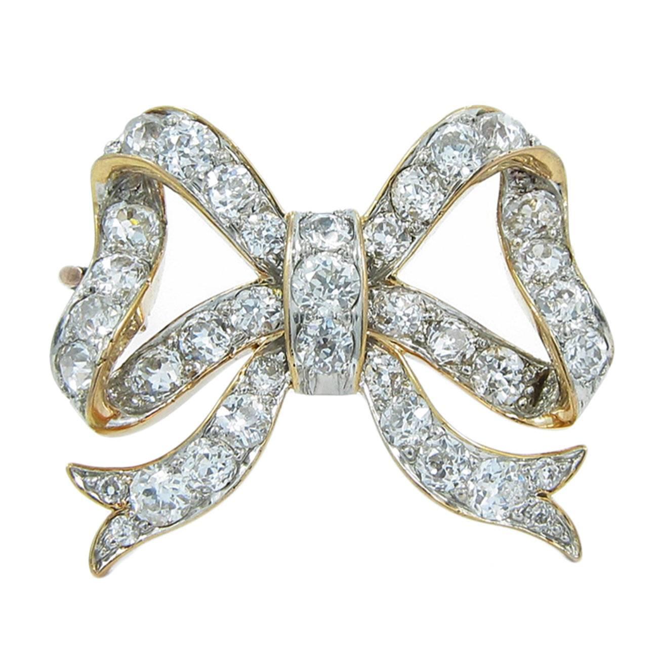 C&Co. Diamond Gold Platinum Bow Pin For Sale