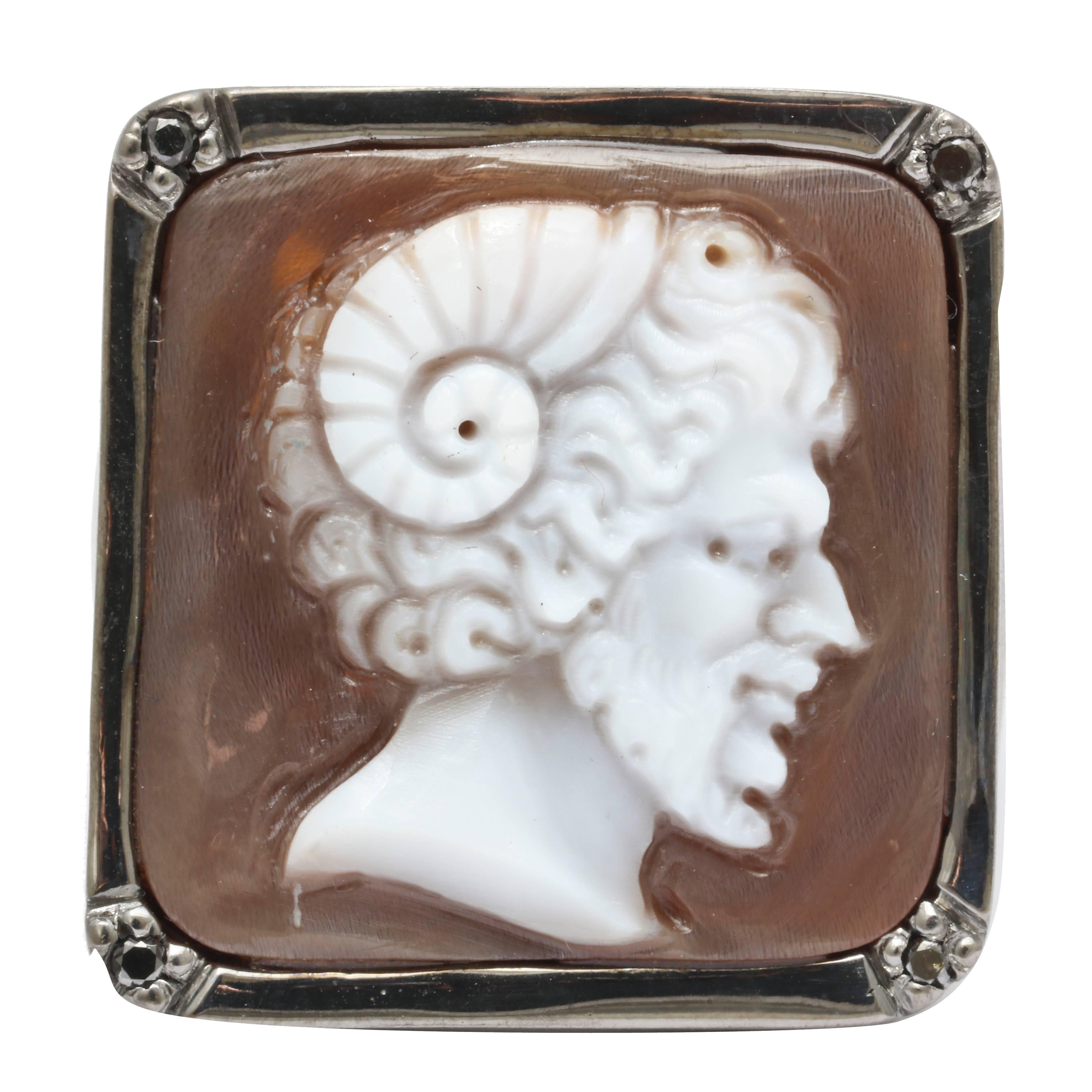 20mm sardonyx shell cameo hand-carved, set in sterling silver black rhodium plated ring with black diamonds.
Ring Size: US10

*Being these are hand crafted one of a kind designs, not all ring sizes might be immediately available. We offer custom