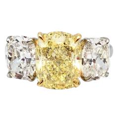 Oscar Heyman 4.28 Carat Fancy Yellow Cushion Cut Three-Stone Diamond Ring