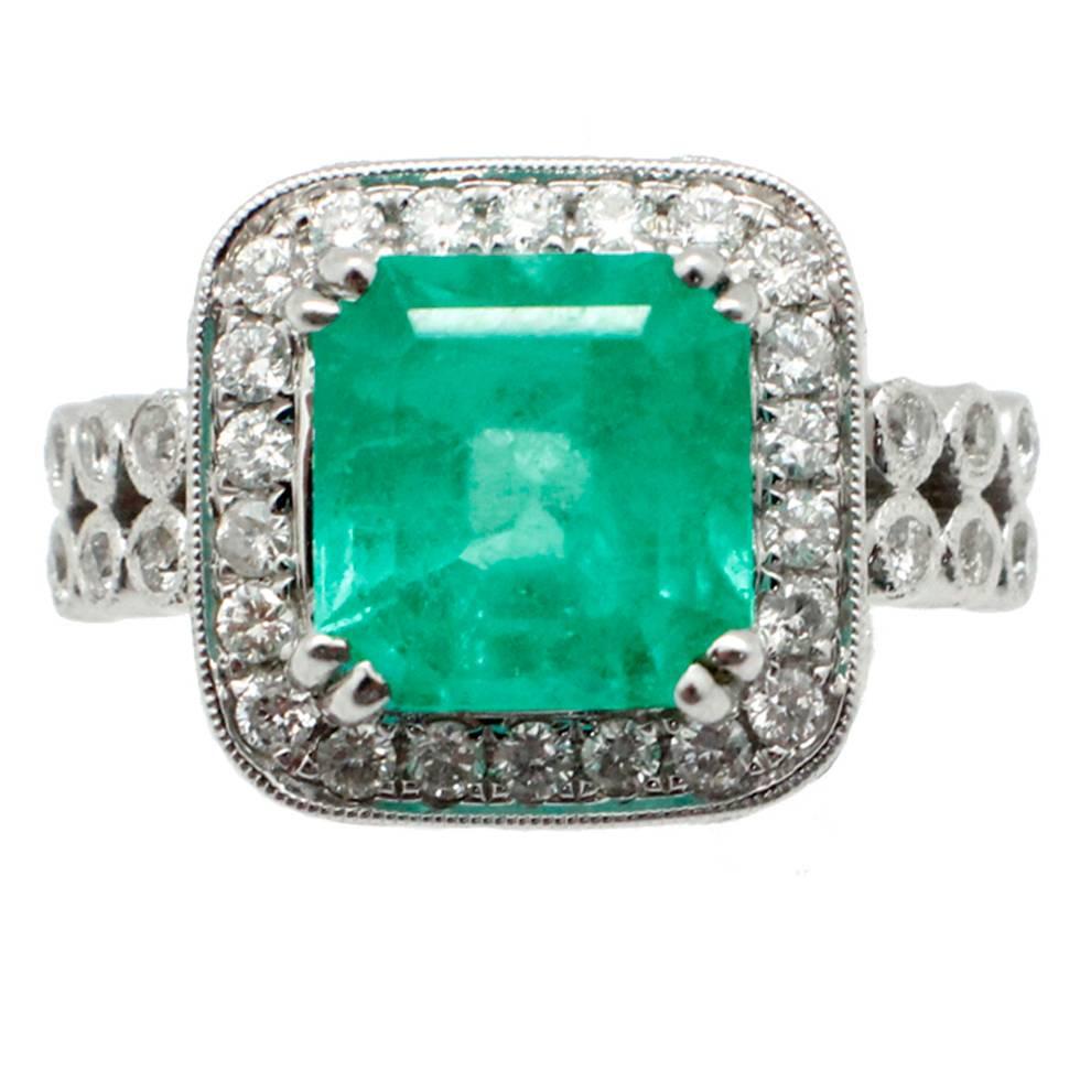4.13 Carat Natural Emerald 1.50 Carats Diamonds 18kt White Gold Statement Ring For Sale