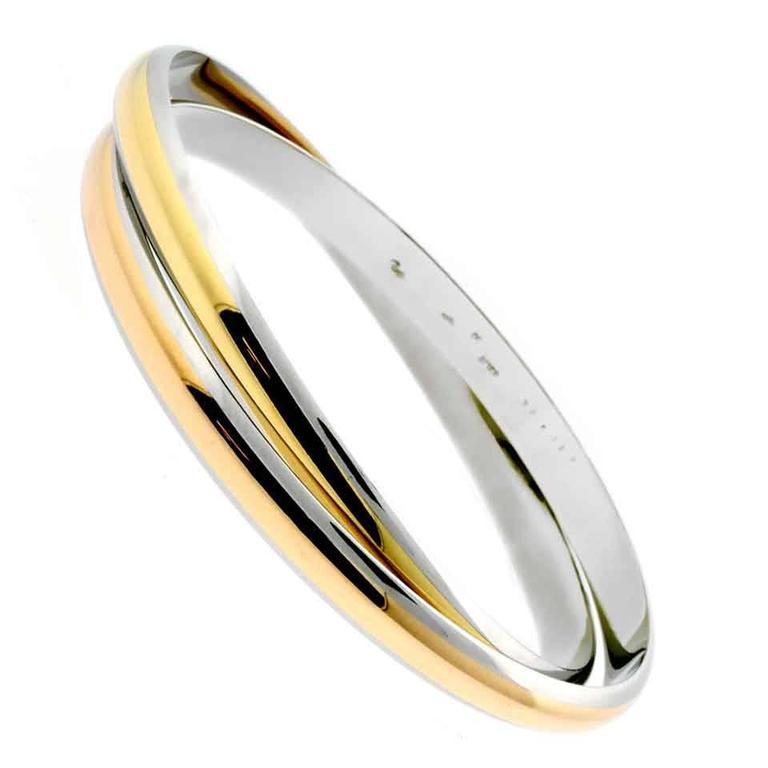 Cartier Interlocking Stainless Steel Gold Bangle Bracelet For Sale