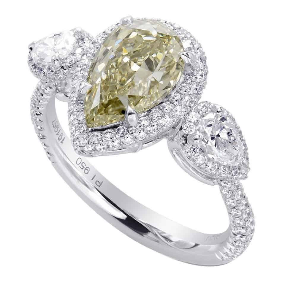 Pear Shape Yellowish Green Three-Stone Diamond Platinum Ring For Sale