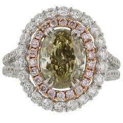 3.00 Oval Green Diamond Two Color Gold Halo Ring