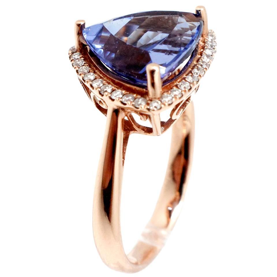 Vivid Violet Blue Trillion 6.07 Carat Tanzanite Diamond Gold Ring For Sale
