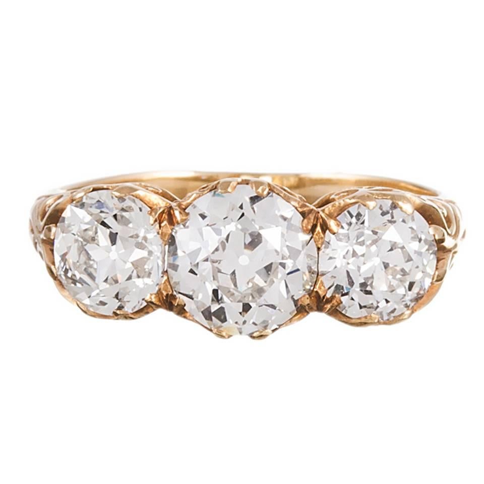 Victorian English Three Stone Diamond Gold Carved Ring