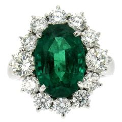 Exceptional 6.60 Carat Emerald 3.30 Carats Diamonds Cluster Ring
