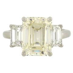 Contemporary 4.13 Carat Emerald Cut Diamond Platinum 3 Stone Engagement Ring 