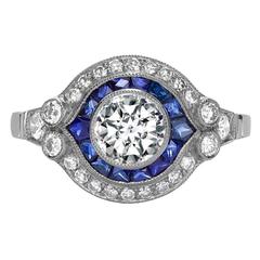 Brilliant Cut Diamond Ring with Sapphire and Diamond Surround Brilliant Cut Diamond Ring with Sapphire and Diamond Surround