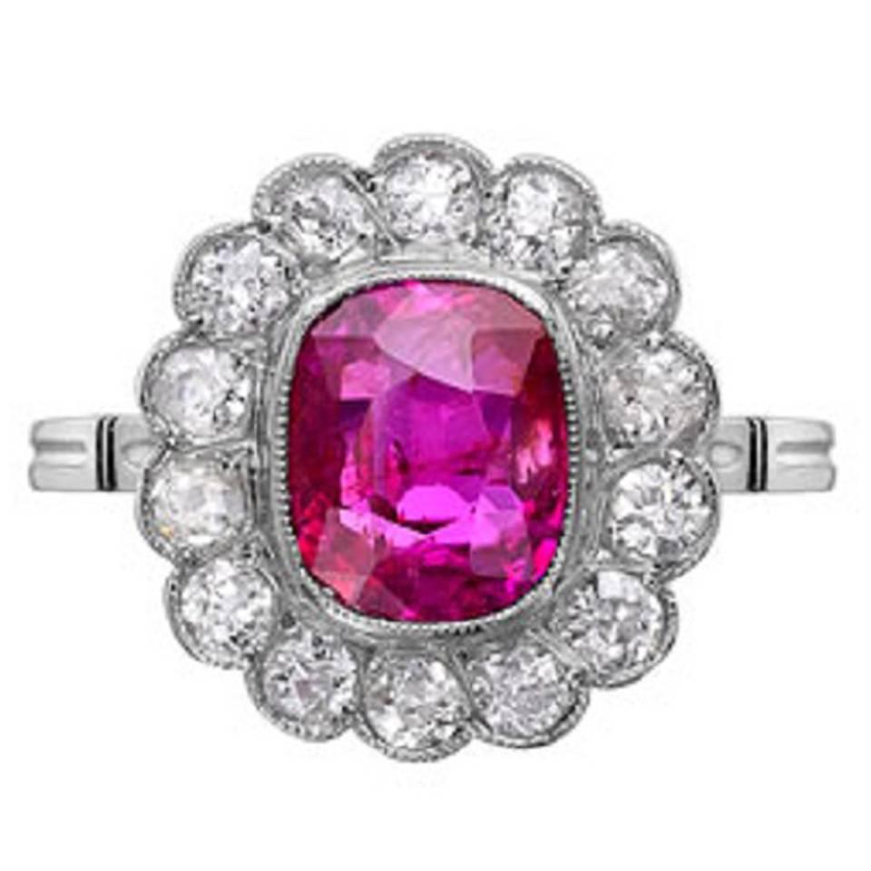Edwardian Cushion Cut Ruby Platinum Ring with Diamond Surround For Sale
