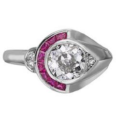 Brilliant cut diamond ring with ruby surround