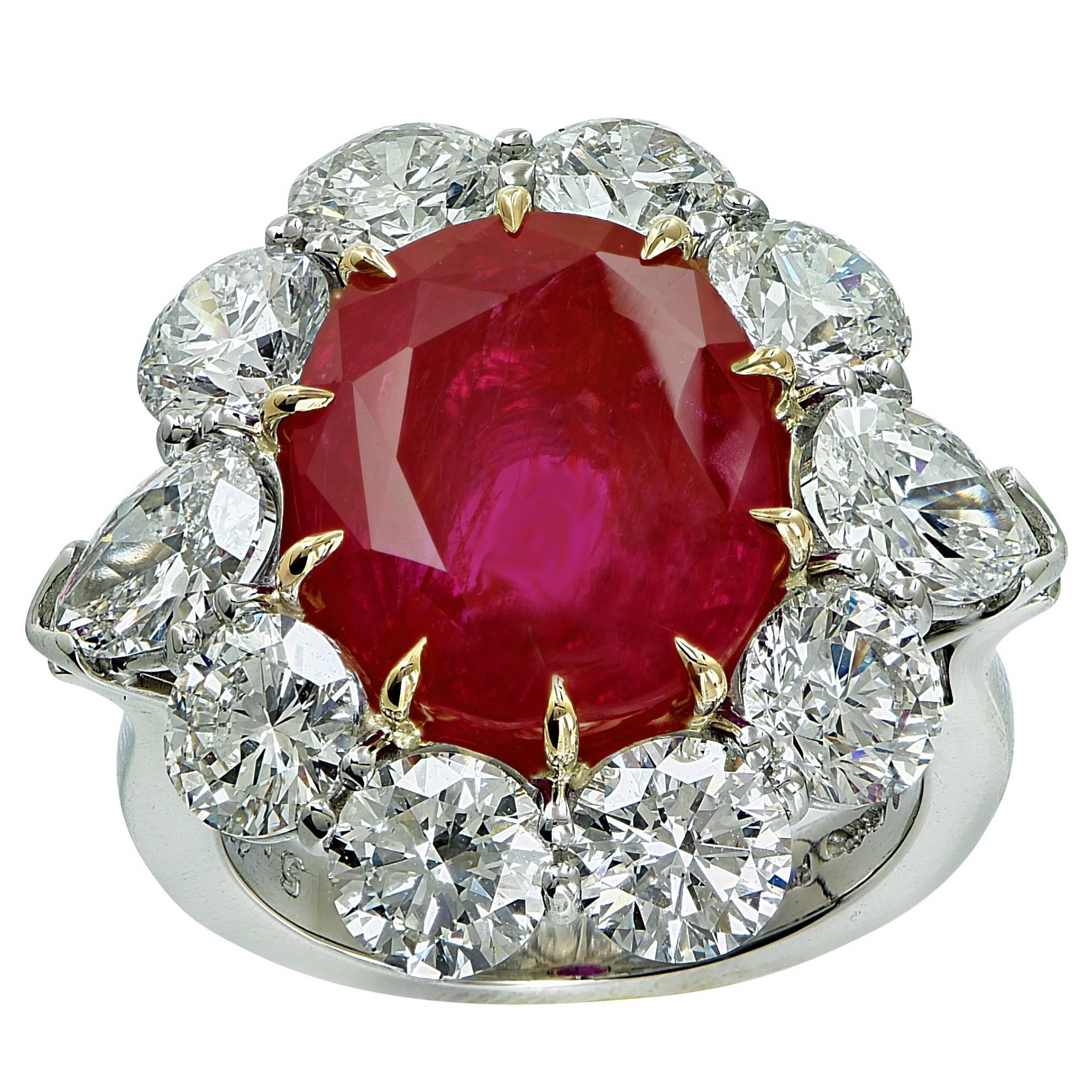 8.66ct Unheated Burma Ruby with AGL report surrounded by 8 GIA graded round brilliant cut and 2 GIA graded pear brilliant cut diamonds with a total weighing of 5.42cts, D-F color, VS1-SI1 clarity, set in to a platinum hand made ring. Signed A.