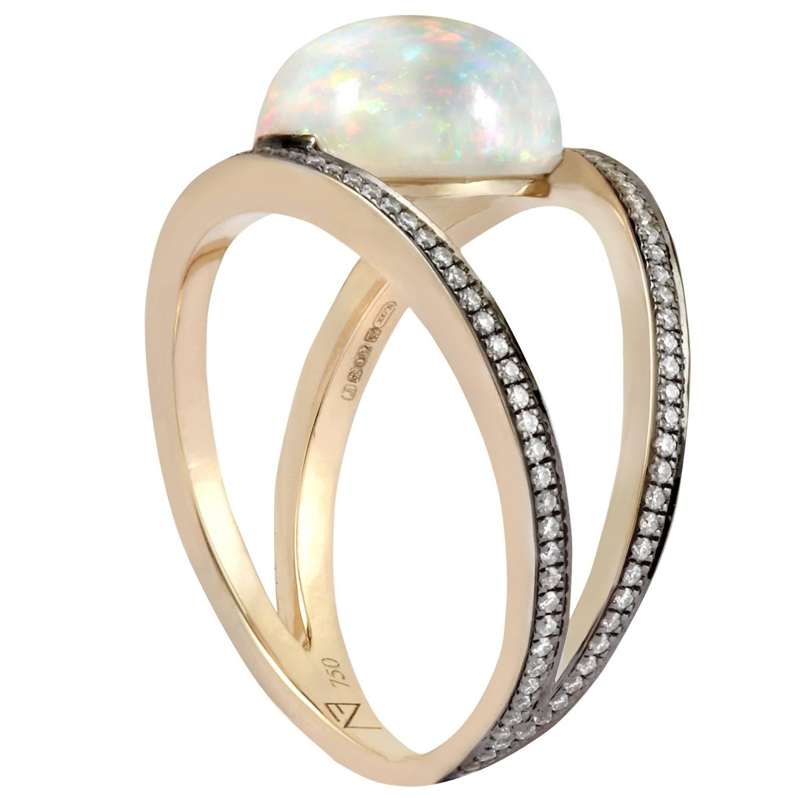 - 18K Grey Gold (4.23 gr.)
- Black Rhodium
- Opal (1 ∅ / 4.50 cts.)
- White Diamonds (H; si / 126 ∅ / 0.22 cts.)

- Sizes available: 52, 53 & 54