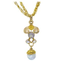 Pendentif élégant en forme de spirale en or, perle d'eau douce et pierre de lune