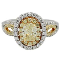 Oval Fancy Intense Yellow Diamond Two Color Gold Ring