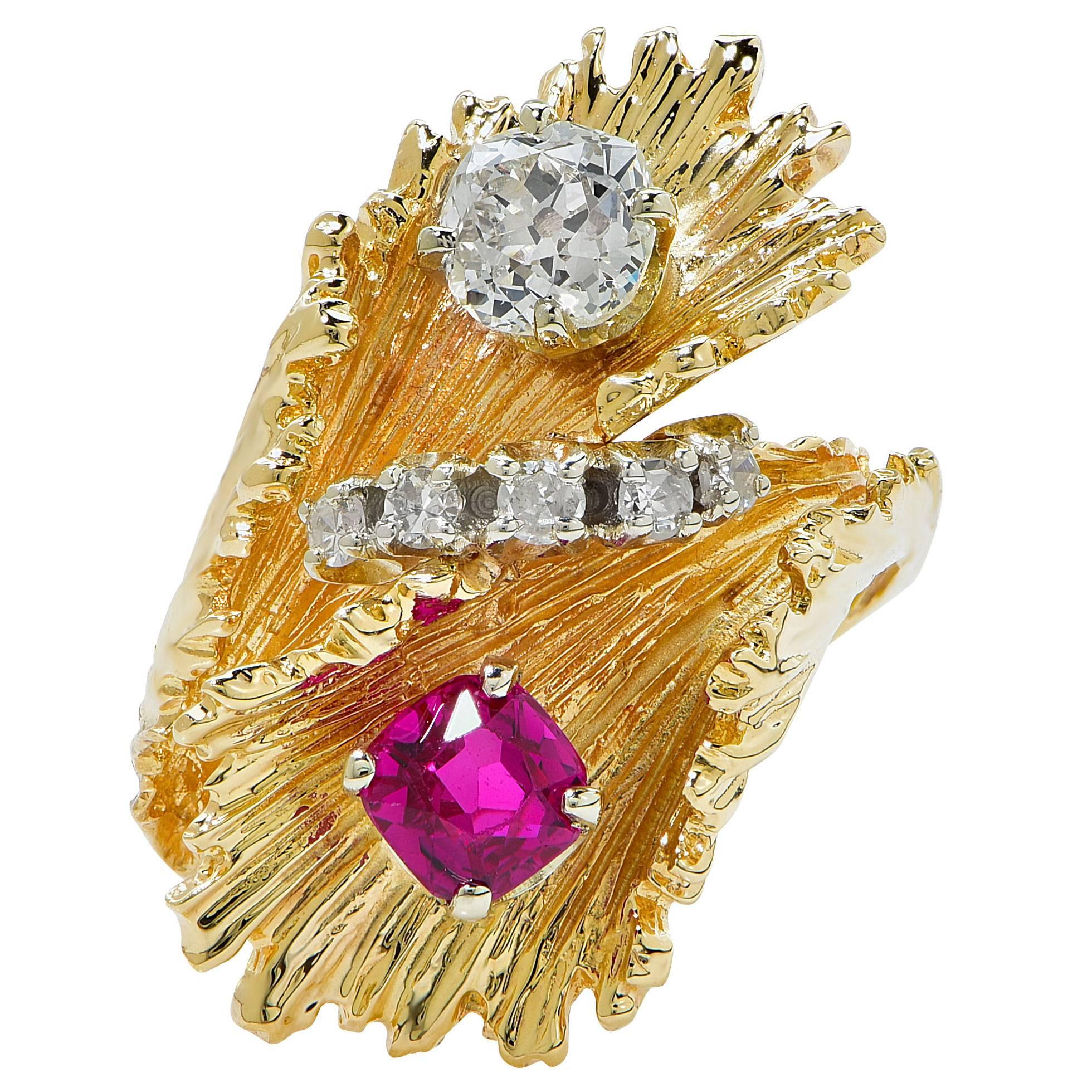 Original diamond and ruby leaf ring featuring a lively red ruby with an estimated weight of one carat and an old European cut diamond with an estimated weight of .75ct a row of 5 single cut diamonds finishes off the design with an estimated total