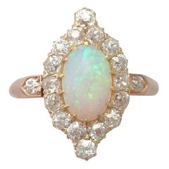 Antique 1900s 1.06 Carat Opal and Diamond Rose Gold Cluster Ring