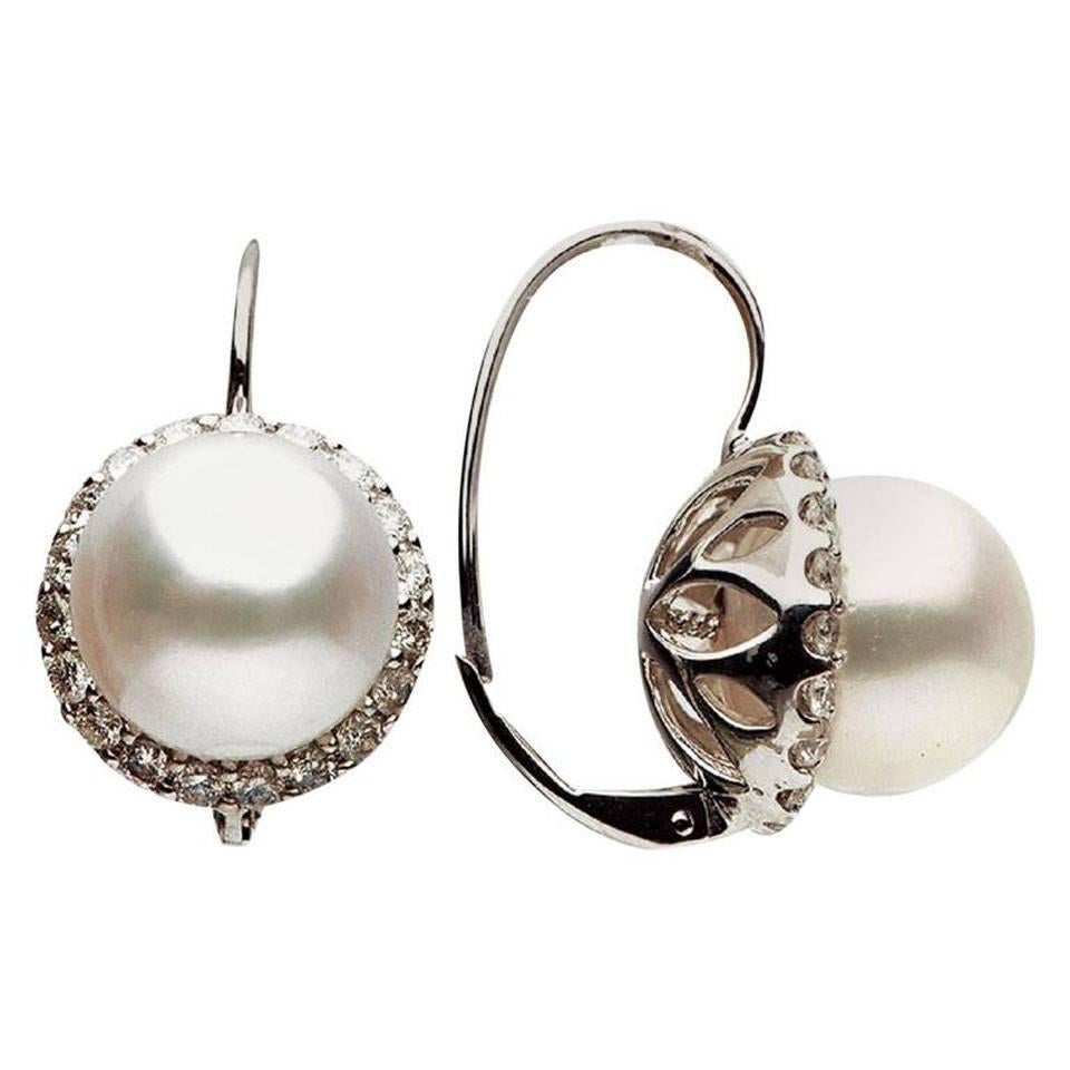 This Beautiful earrings features:
Pearl size: 10-11 mm
Pearl: South Sea Cultured Pearl
Pearl Quality: AAA
Luster: AAA Exc.
Nacre: Very Thick
Earring Style: Lever back
Metal: 18K White Gold
Diamond Count: 38
Diamond Weight: 1.10 Cts.