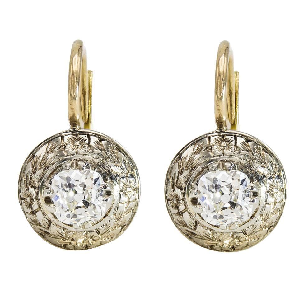 Round Diamond Earrings with a Halo of Engraved White Gold
