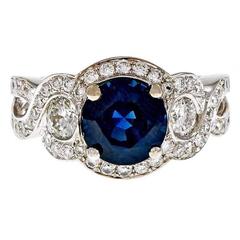 Royal Blue Round Sapphire Diamond Swirl Halo Gold Engagement Ring