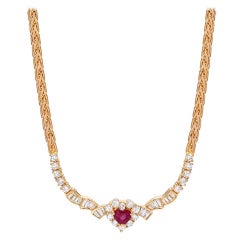 Collier en or avec cœur en rubis et diamants