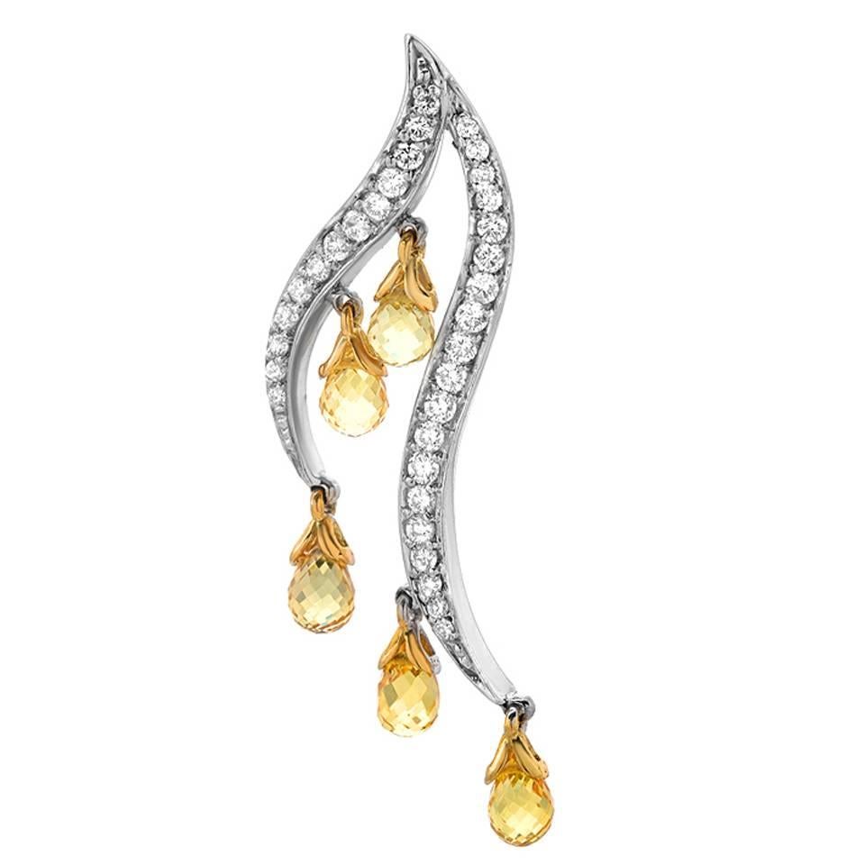 A very unique pair of gold earrings fearing 10 briolette cut yellow sapphires weighing 6.29 carats. 
Round cut diamonds, 1.01 carats, are set in 18K white gold. 

Dimensions: 1.75 x 0.50 inches 