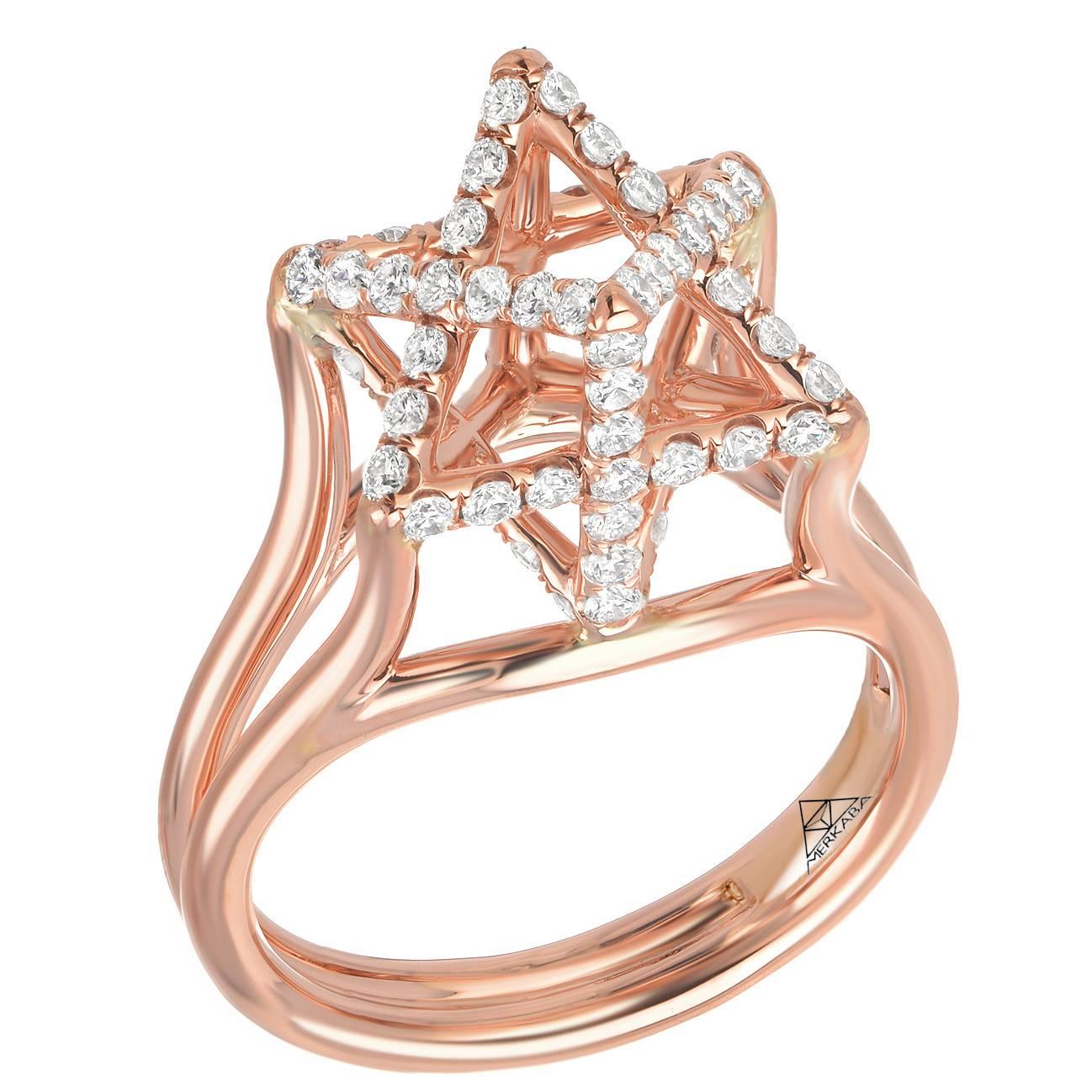 This Merkaba heirloom-quality 18k rose gold ring features a total of approximately 0.98 carats of round brilliant diamonds of F-G color and VVS2-VS1 clarity. This dramatic, sculptural design extends upward from the hand 0.43”, a stunning