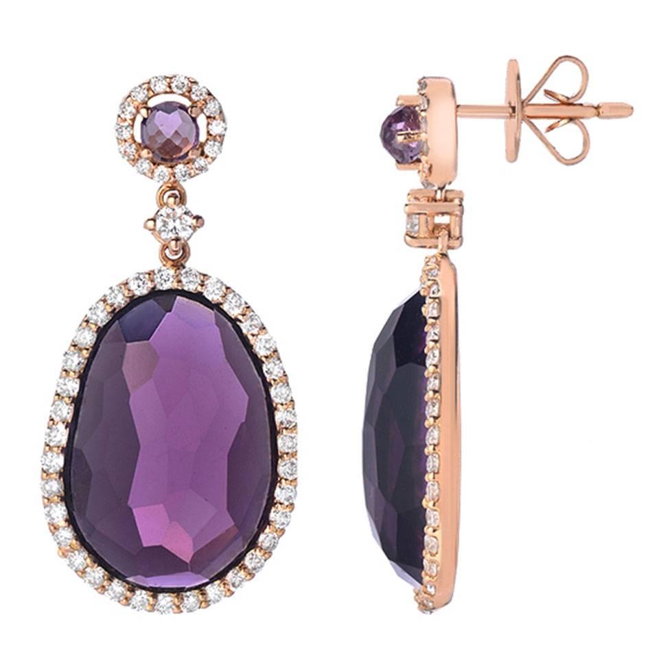 These earrings feature 17.45 carats of faceted cabochon amethyst with 1.09 carats of VS-SI clarity G-H color round cut diamonds. Made in 18K rose gold.   
